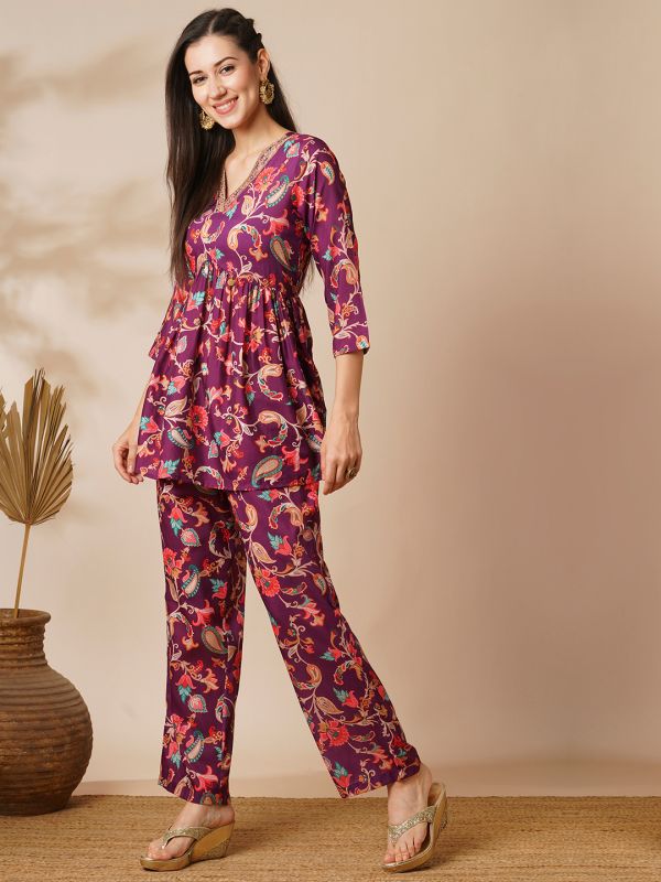 Globus Women Burgundy Floral Embroidered Jaal Print V-Neck With Tassel Detailing A-Line Peplum Tunic & Mid Rise Partially Elasticated Ankle Length Pants Fusion Co-Ord Set