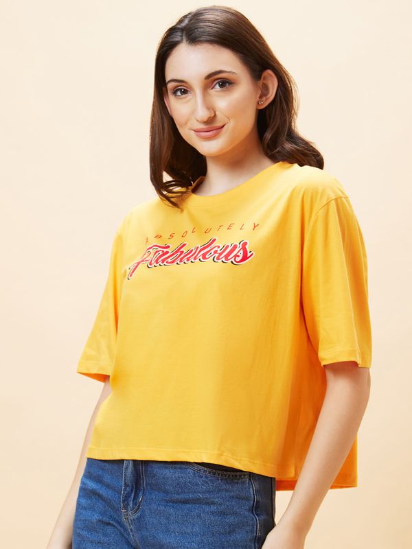 Globus Women Yellow Typography Print Round Neck Boxy Fit Casual Crop T-Shirt