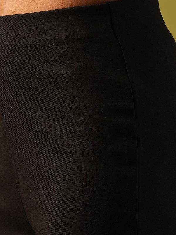 Globus Women Black Solid Stretchable Mid-Rise High-Low Bottom Hem Flared Party Treggings